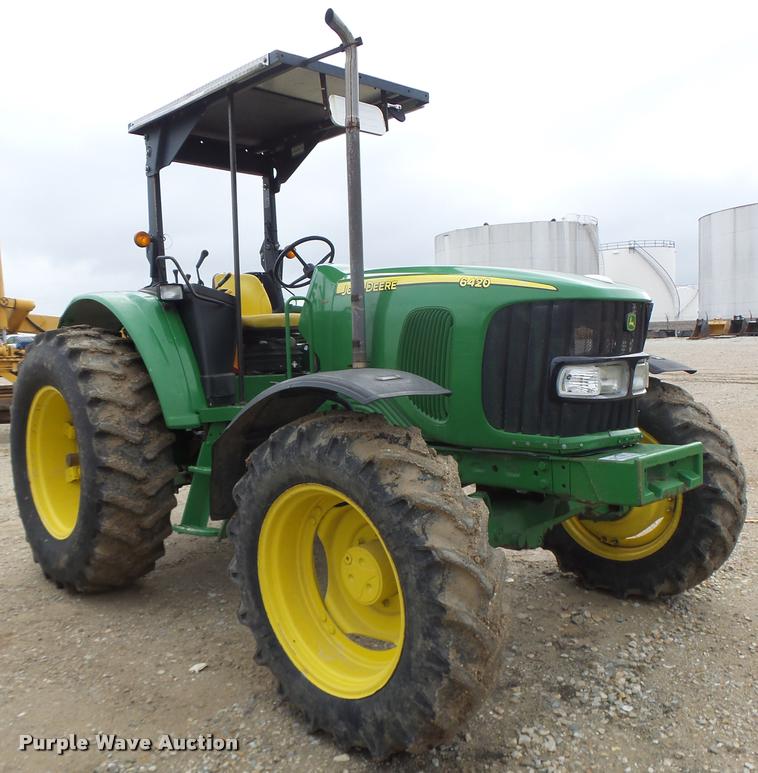 image for item K5597 2002 John Deere 6420 MFWD tractor