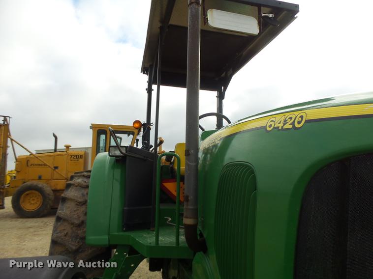 image for item K5597 2002 John Deere 6420 MFWD tractor
