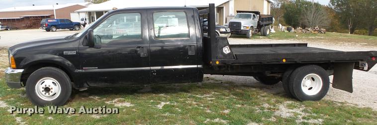 image for item K1055 2000 Ford F350 Super Duty Crew Cab flatbed pickup truck