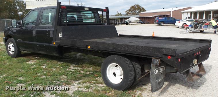 image for item K1055 2000 Ford F350 Super Duty Crew Cab flatbed pickup truck