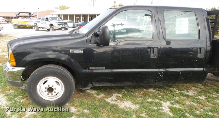 image for item K1055 2000 Ford F350 Super Duty Crew Cab flatbed pickup truck