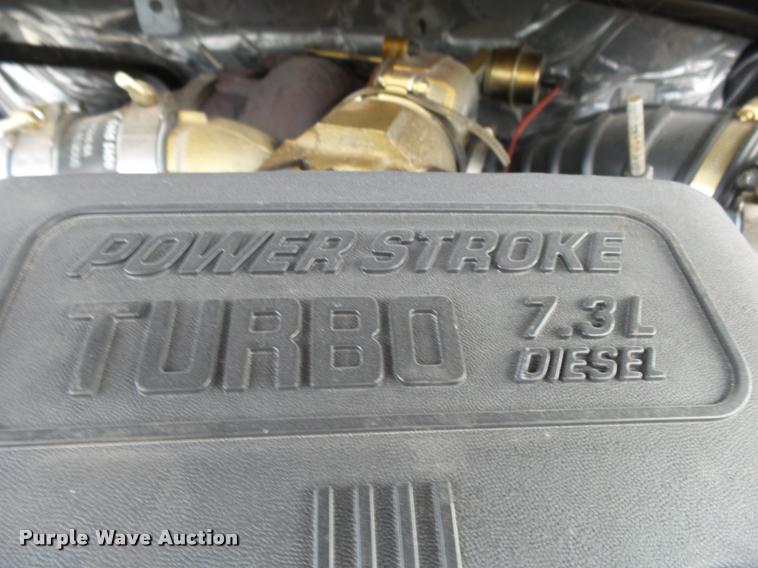 image for item K1055 2000 Ford F350 Super Duty Crew Cab flatbed pickup truck