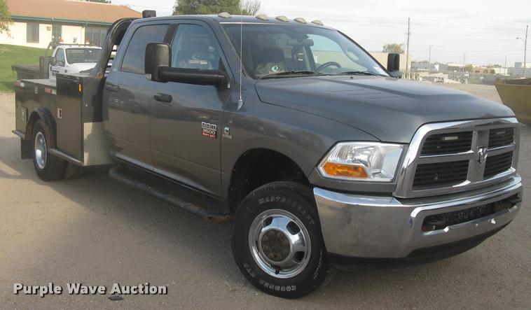 image for item L3902 2011 Dodge Ram 3500HD SLT Crew Cab flatbed pickup truck