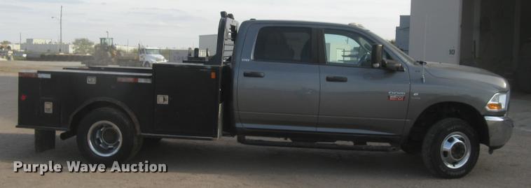 image for item L3902 2011 Dodge Ram 3500HD SLT Crew Cab flatbed pickup truck