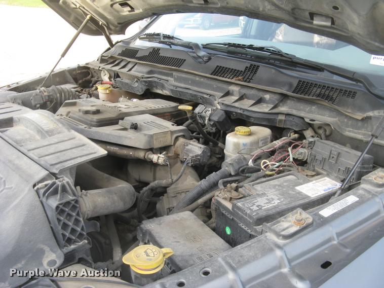 image for item L3902 2011 Dodge Ram 3500HD SLT Crew Cab flatbed pickup truck