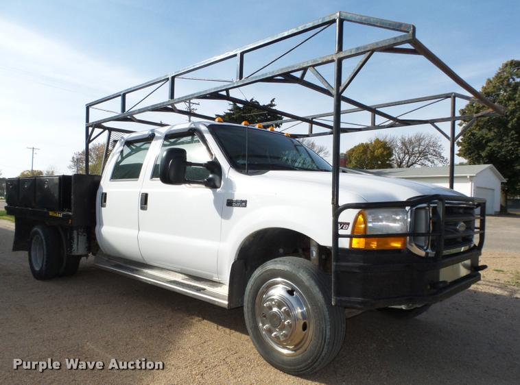 image for item L4100 1999 Ford F550 Super Duty XLT Crew Cab flatbed truck