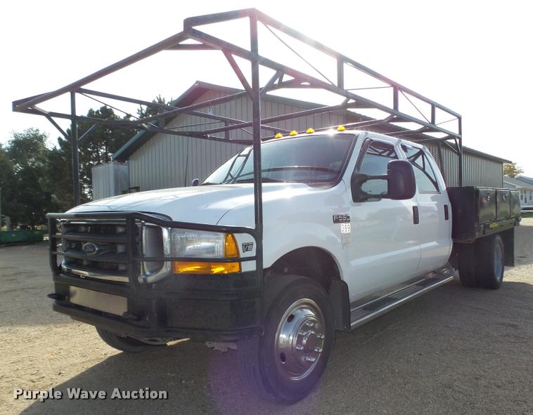 image for item L4100 1999 Ford F550 Super Duty XLT Crew Cab flatbed truck