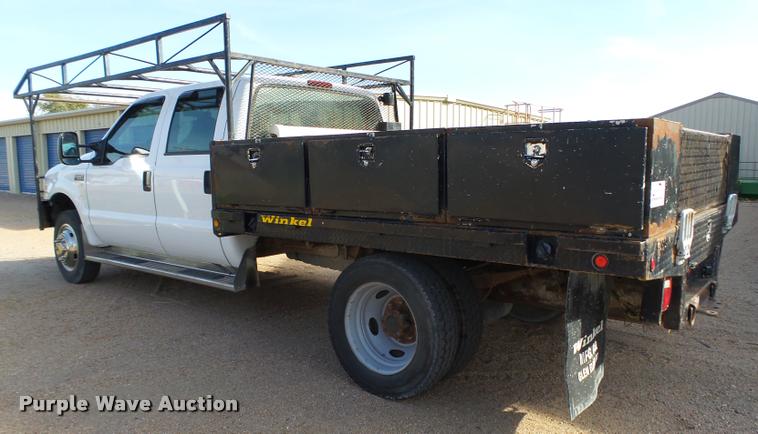 image for item L4100 1999 Ford F550 Super Duty XLT Crew Cab flatbed truck