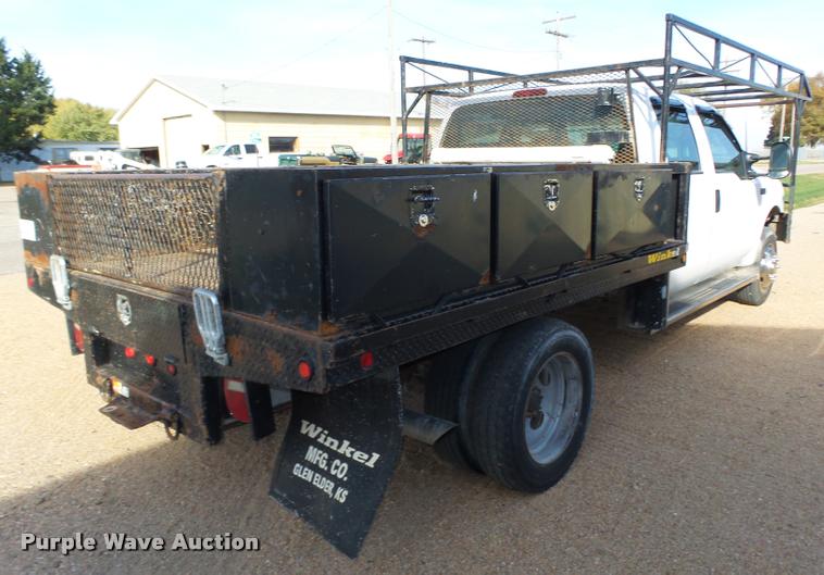 image for item L4100 1999 Ford F550 Super Duty XLT Crew Cab flatbed truck