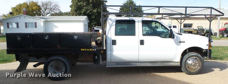 image for item L4100 1999 Ford F550 Super Duty XLT Crew Cab flatbed truck