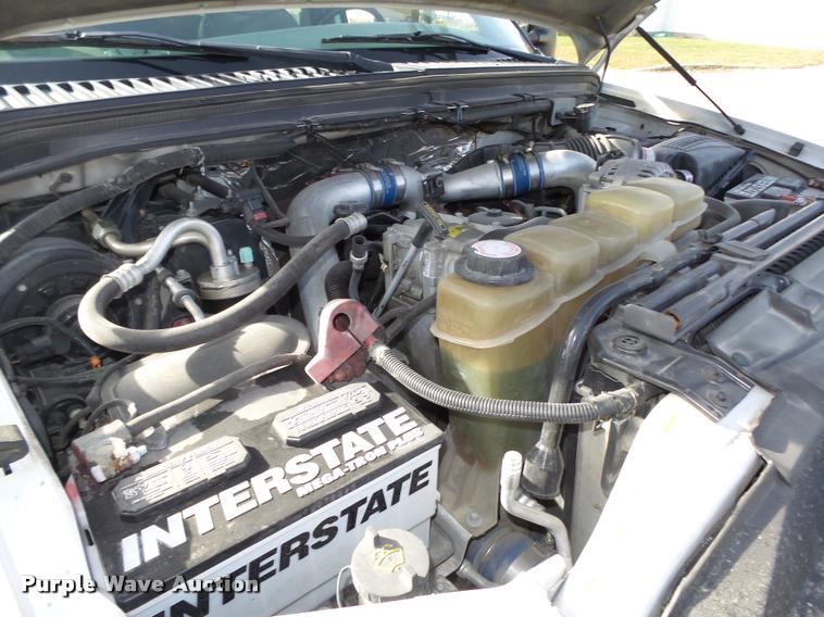 image for item L4100 1999 Ford F550 Super Duty XLT Crew Cab flatbed truck