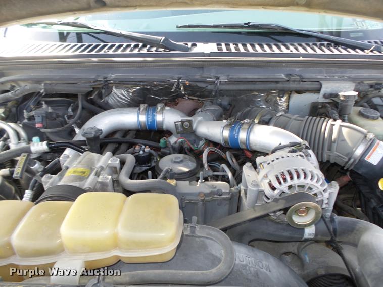 image for item L4100 1999 Ford F550 Super Duty XLT Crew Cab flatbed truck