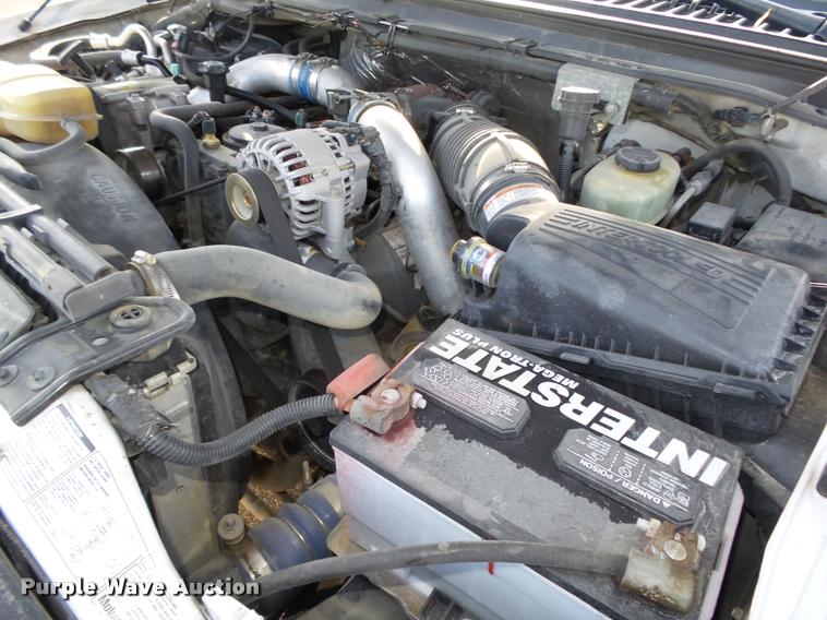 image for item L4100 1999 Ford F550 Super Duty XLT Crew Cab flatbed truck