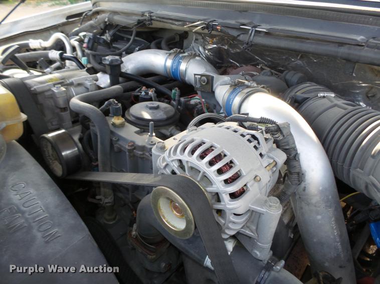 image for item L4100 1999 Ford F550 Super Duty XLT Crew Cab flatbed truck