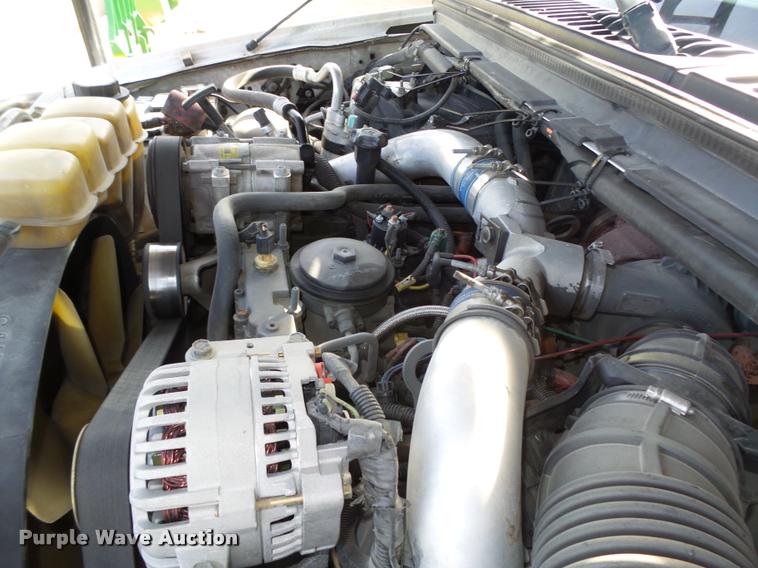 image for item L4100 1999 Ford F550 Super Duty XLT Crew Cab flatbed truck