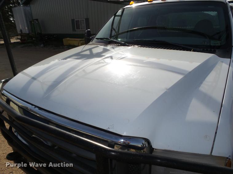 image for item L4100 1999 Ford F550 Super Duty XLT Crew Cab flatbed truck