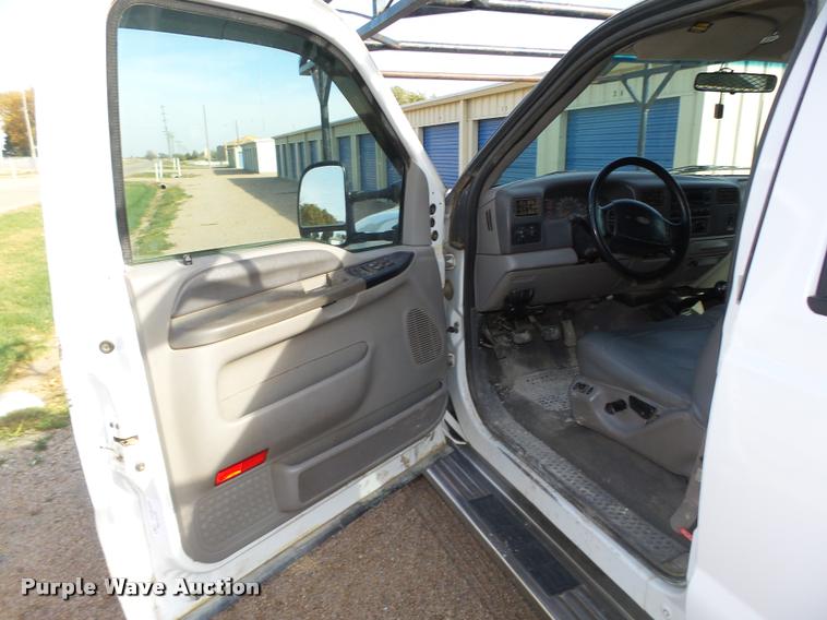 image for item L4100 1999 Ford F550 Super Duty XLT Crew Cab flatbed truck