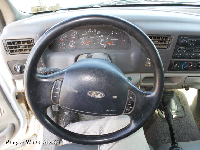 image for item L4100 1999 Ford F550 Super Duty XLT Crew Cab flatbed truck