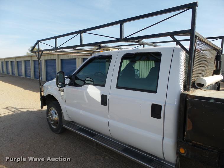 image for item L4100 1999 Ford F550 Super Duty XLT Crew Cab flatbed truck