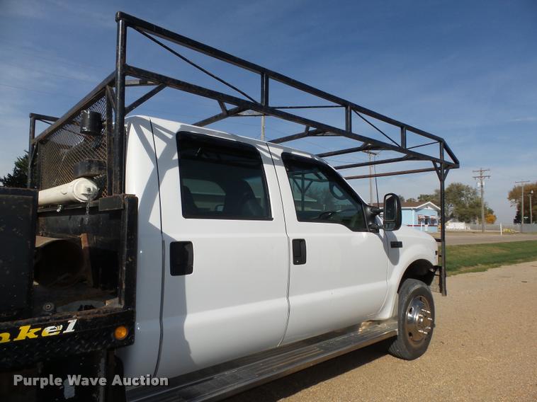 image for item L4100 1999 Ford F550 Super Duty XLT Crew Cab flatbed truck