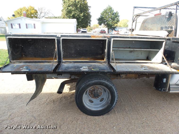 image for item L4100 1999 Ford F550 Super Duty XLT Crew Cab flatbed truck
