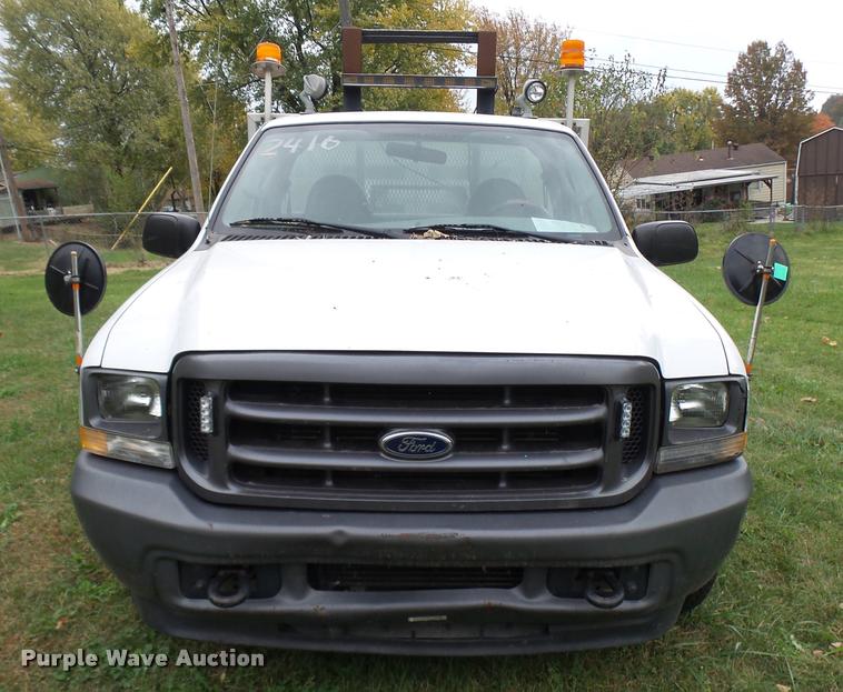 image for item L7146 2004 Ford F250 Super Duty flatbed pickup truck