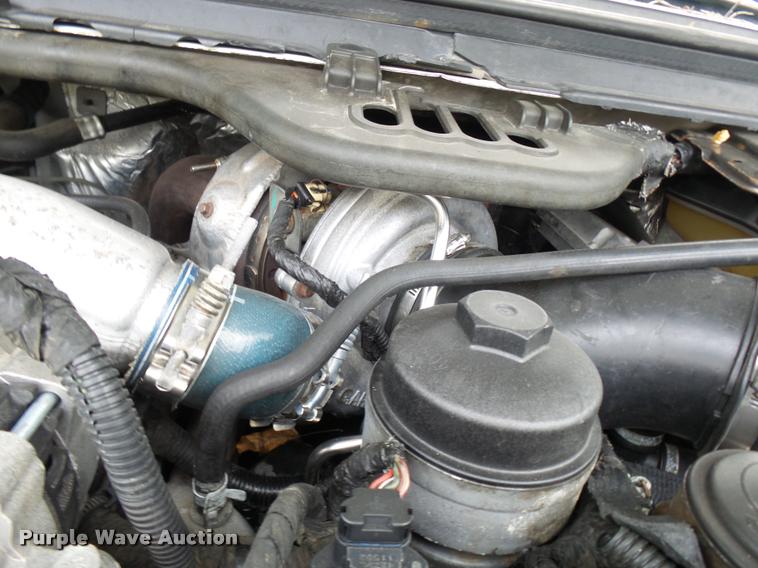 image for item L7146 2004 Ford F250 Super Duty flatbed pickup truck