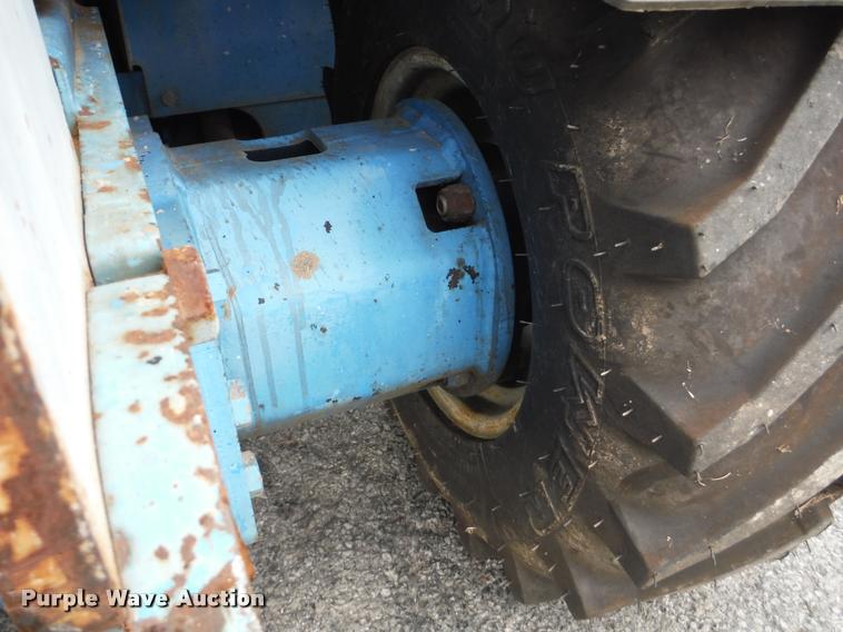 image for item K7710 1999 Genie GS-3268RT scissor lift