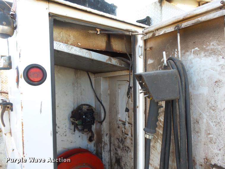 image for item DB0073 2001 Freightliner FL60 service truck with crane