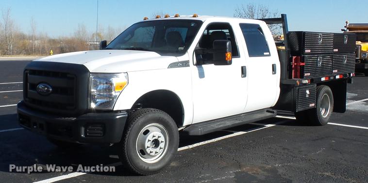 image for item AX9053 2012 Ford F350 Super Duty Crew Cab flatbed pickup truck