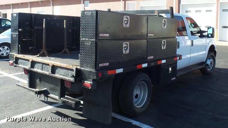 image for item AX9053 2012 Ford F350 Super Duty Crew Cab flatbed pickup truck