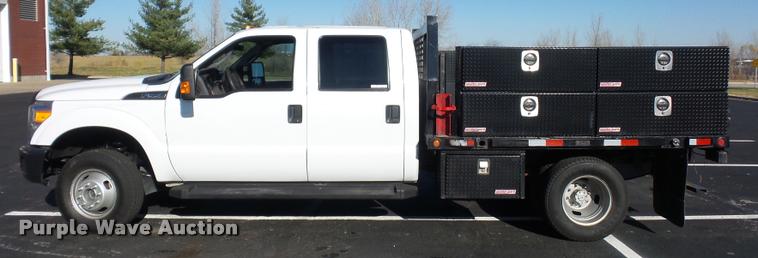 image for item AX9053 2012 Ford F350 Super Duty Crew Cab flatbed pickup truck