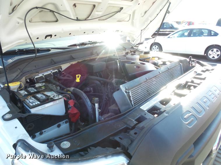 image for item AX9053 2012 Ford F350 Super Duty Crew Cab flatbed pickup truck