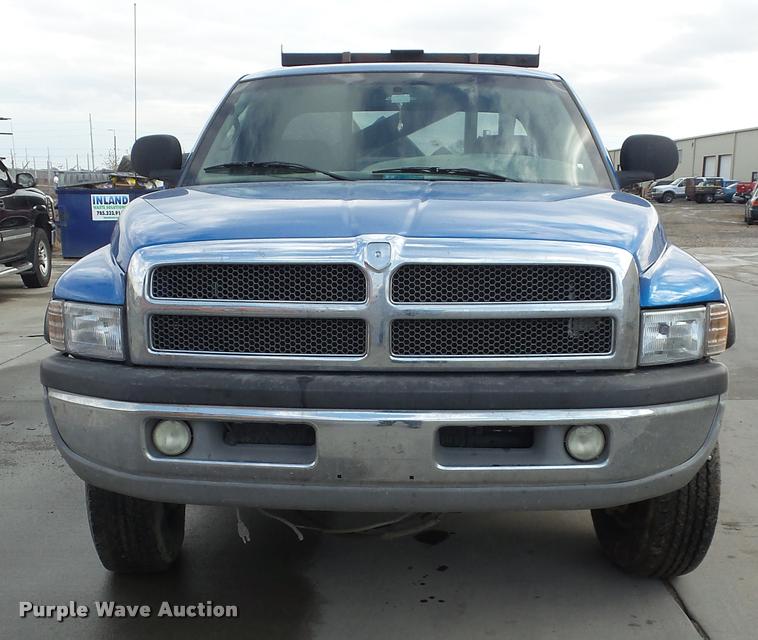 image for item J5725 2001 Dodge Ram 2500 Laramie SLT Quad Cab flatbed pickup truck