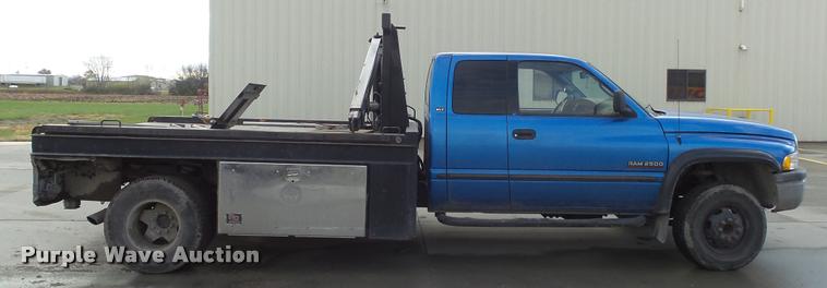 image for item J5725 2001 Dodge Ram 2500 Laramie SLT Quad Cab flatbed pickup truck