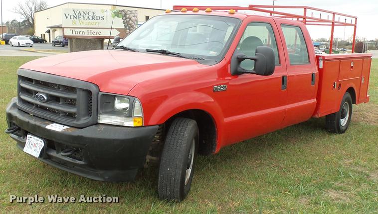 image for item K3426 2003 Ford F250 Super Duty Crew Cab flat bed truck