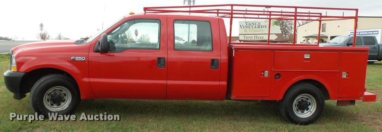 image for item K3426 2003 Ford F250 Super Duty Crew Cab flat bed truck
