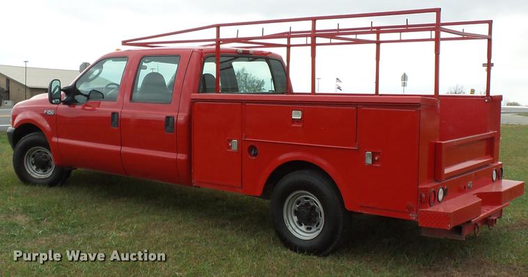 image for item K3426 2003 Ford F250 Super Duty Crew Cab flat bed truck
