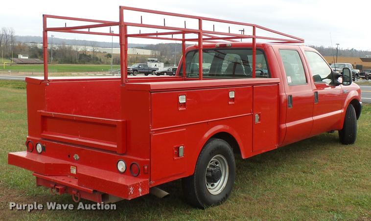 image for item K3426 2003 Ford F250 Super Duty Crew Cab flat bed truck