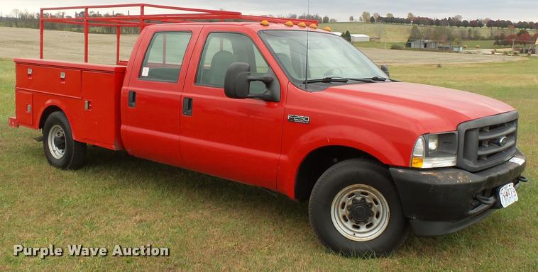 image for item K3426 2003 Ford F250 Super Duty Crew Cab flat bed truck