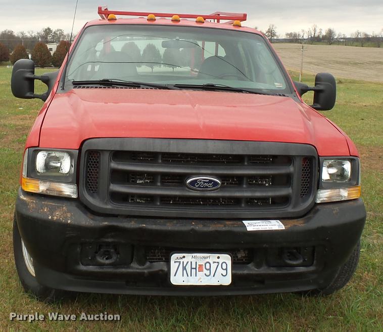 image for item K3426 2003 Ford F250 Super Duty Crew Cab flat bed truck