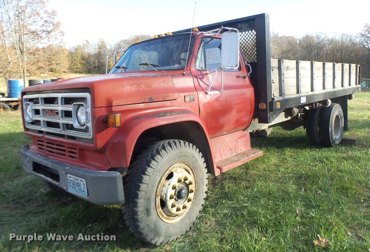 image for item K5556 1987 GMC C7D042 dump flatbed truck