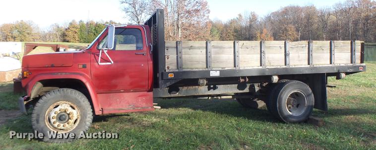 image for item K5556 1987 GMC C7D042 dump flatbed truck
