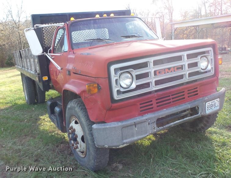 image for item K5556 1987 GMC C7D042 dump flatbed truck