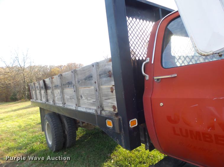 image for item K5556 1987 GMC C7D042 dump flatbed truck