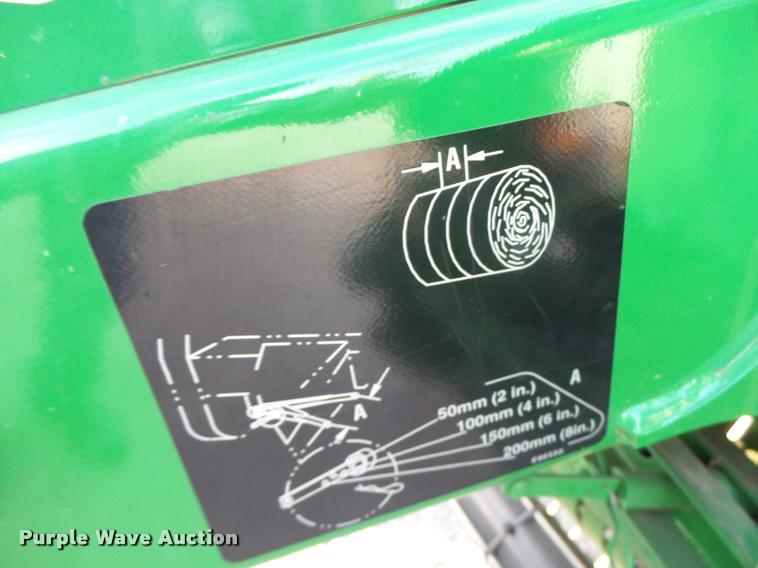 image for item K5524 2013 John Deere 569 Premium round baler