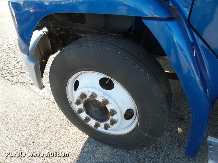 image for item AX9047 2002 Freightliner FL60 flatbed truck