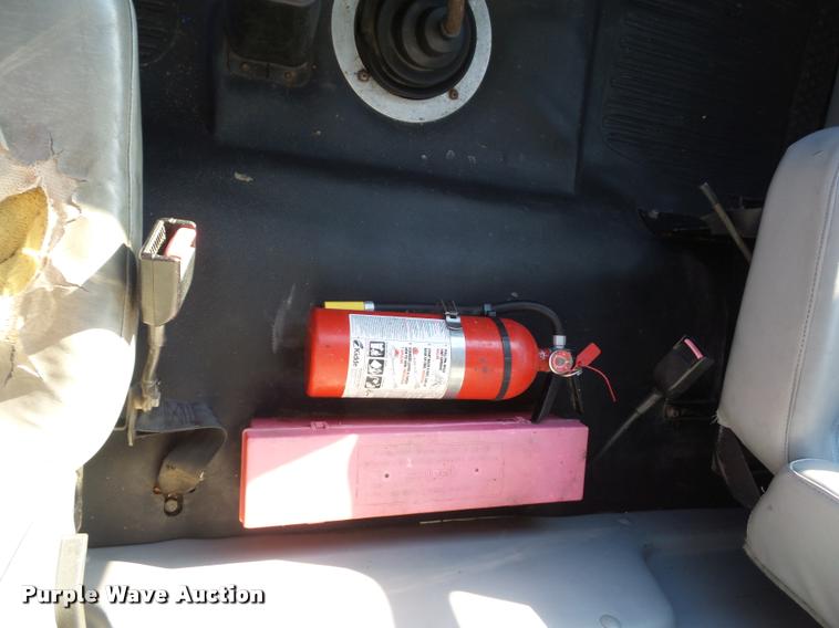 image for item AX9047 2002 Freightliner FL60 flatbed truck