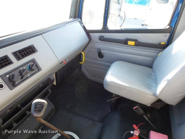 image for item AX9047 2002 Freightliner FL60 flatbed truck