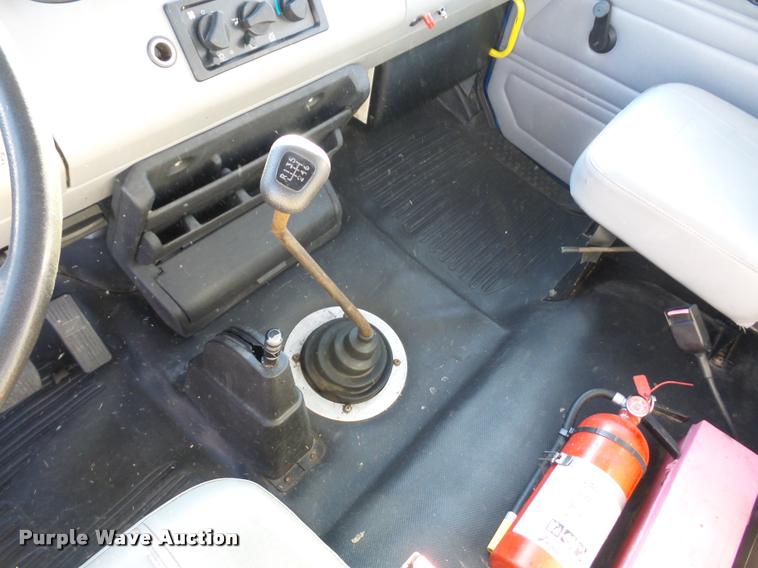 image for item AX9047 2002 Freightliner FL60 flatbed truck